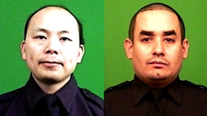 Les deux policiers tués samedi à Brooklyn. Les deux policiers tués samedi à Brooklyn.