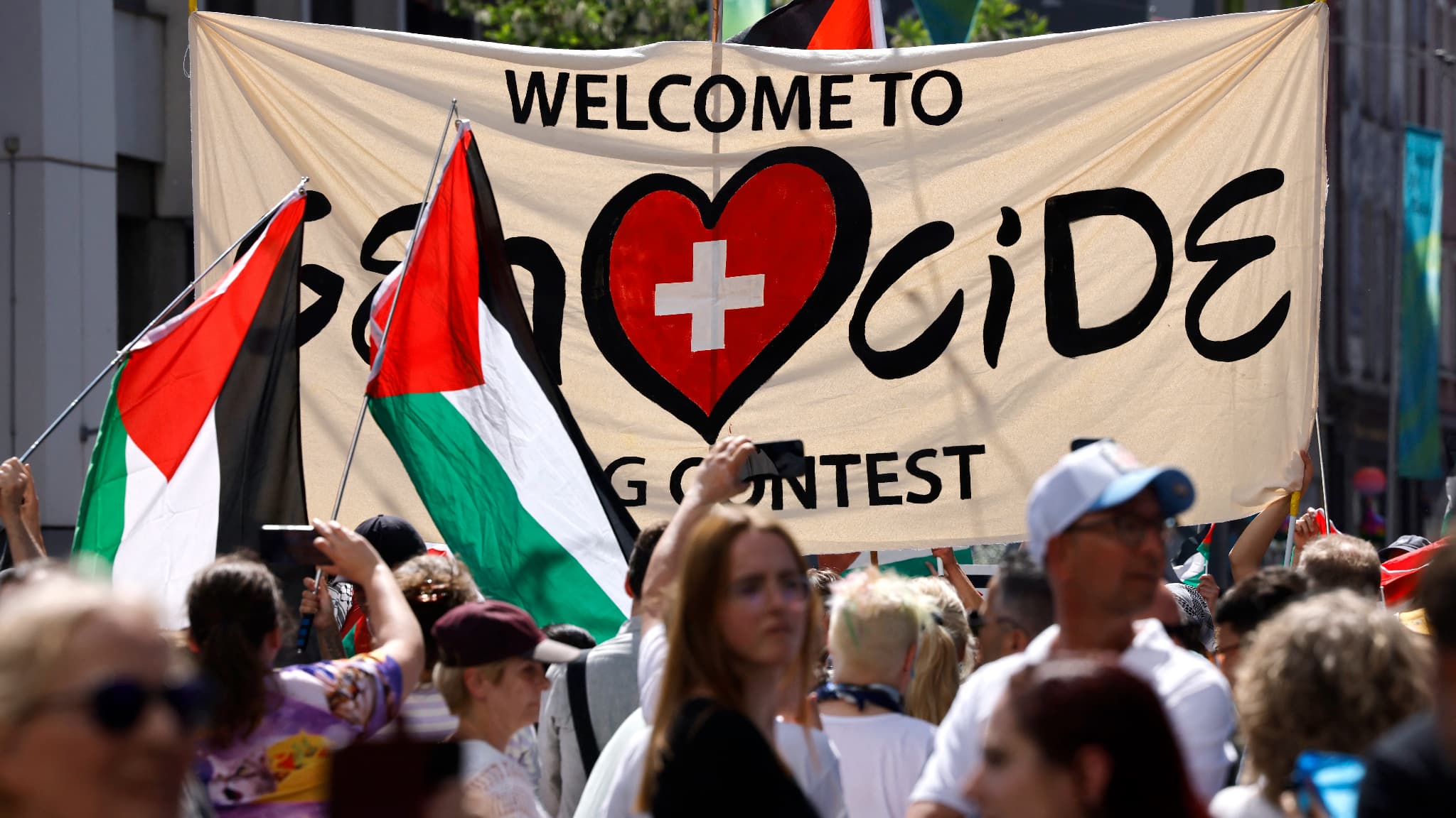 The protesters wielded Palestinian flags and a banner while participating in a demonstration against the Israel candidate and during the opening ceremony of the Eurovision of song 2025 in Basel on May 11, 2025. The protesters wielded Palestinian flags and a banner while participating in a demonstration against the Israel candidate and during the opening ceremony of the Eurovision of song 2025 in Basel on May 11, 2025.