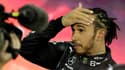 Le Britannique Lewis Hamilton, après avoir terminé 2e du Grand Prix d'Abou Dhabi et perdu le titre mondial face au vainqueur néerlandais Max Vertsappen, le 12 décembre 2021 sur le circuit de Yas Marina