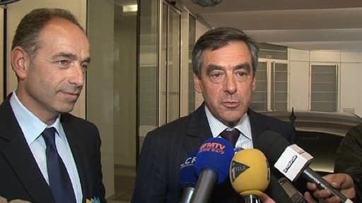 Jean-François Copé et François Fillon au siège de l'UMP, à Paris, le mardi 14 mai.