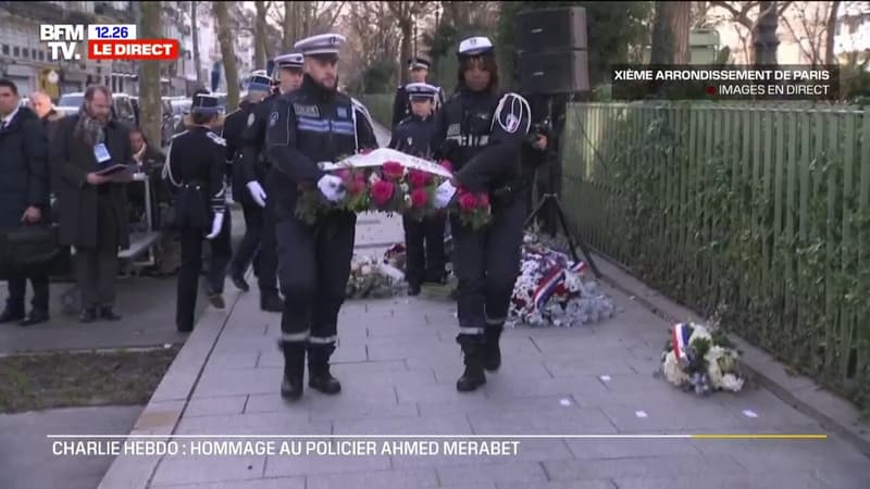 Attentats du 7-Janvier: des gerbes déposées boulevard Richard Lenoir, en hommage au lieutenant de police Ahmed Merabet