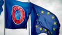 Les drapeaux de l'UEFA et de l'Union européenne, à  Comines-Warneton (Belgique) le 11 décembre 2014