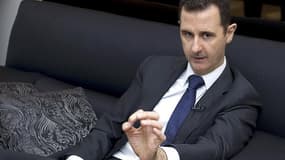Bachar al Assad lors d'une interview en juin dernier. Les rebelles disent avoir pris pour cible jeudi le convoi du président syrien alors qu'il se rendait dans une mosquée de Damas pour la fête musulmane de l'Aïd el Fitr et la télévision publique syrienne