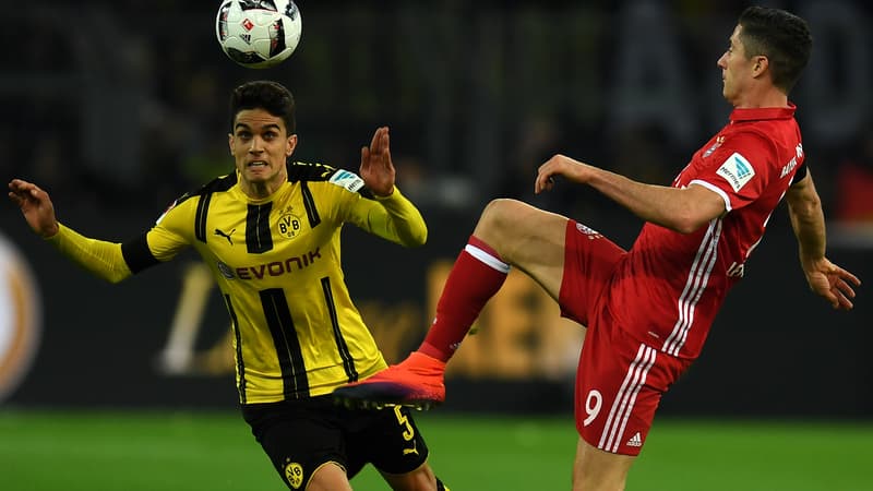 Le défenseur de Dortmund, Marc Bartra (en jaune), face au Munichois Robert Lewandowski.