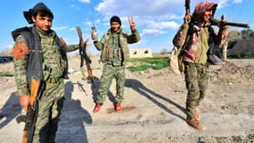 Membres des forces démocratiques syriennes après une opération réussie à Baghouz contre Daesh, le 19 mars 2019
