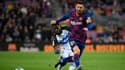 Lionel Messi devant Mubarak Wakaso, à Barcelone le 21 décembre 2019