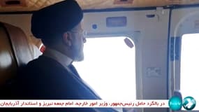 Une capture d'écran de la télévision d'Etat montre le président iranien Ebrahim Raïssi à bord d'un hélicoptère dans la région de Djolfa, le 19 mai 2024