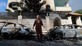 Des voitures brûlées lors d'une attaque de colons juifs dans le village de Jit, en Cisjordanie occupée, le 16 août 2024
