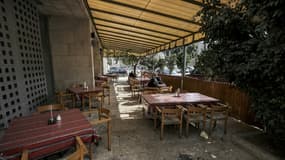 Restaurant désert à Bethléem, en Cisjordanie, en pleine haute saison touristique d'avant-Noël pour cause de pandémie de Covid-19, le 15 décembre 2022