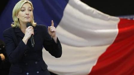 Au plus haut dans les sondages, Marine Le Pen et le Front national entendent profiter du débat sur l'islam annoncé par Nicolas Sarkozy pour grignoter davantage le capital électoral de la majorité à un an de la présidentielle. /Photo prise le 19 décembre 2
