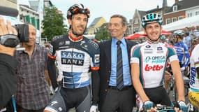 Rik Van Looy (en costume au centre) entouré de Fabian Cancellara et Jurgen Van Den Broeck, le 29 juillet 2010