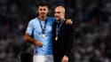 Rodri aux côtés de son entraîneur, Pep Guardiola