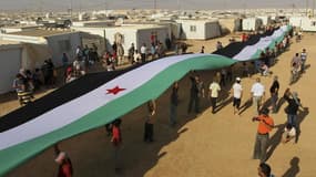 Réfugiés syriens dans un camp en Jordanie. Le nombre de personnes fuyant la guerre civile en Syrie s'est accru pour atteindre une moyenne de 6.000 réfugiés par jour en 2013, soit un niveau jamais vu depuis le génocide commis au Rwanda en 1994, selon le Ha
