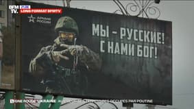 RED LINE - In Lugansk, a city annexed by Russia last September, billboards glorifying the Kremlin have flourished