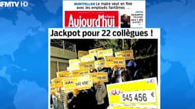 Les heureux gagnants arborent leurs 22 chèques de 545.456 euros.