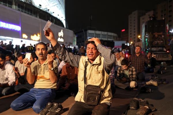 Iranians pray for President Ibrahim Raisi, who went missing in a plane crash in Tehran on May 19, 2024.