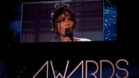 La cérémonie des Grammy Awards, qui a consacré la chanteuse britannique Adele dimanche, a rendu hommage à Whitney Houston (photo), morte la veille à 48 ans. /Photo prise le 12 février 2012/REUTERS/Mario Anzuoni