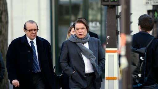 Bernard Tapie (C) et son avocat Hervé Temime le 12 mars 2015 à Paris