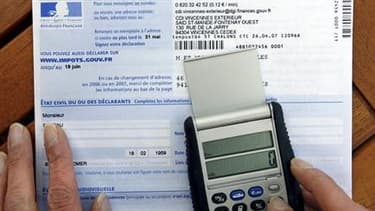 Les députés ont adopté par 310 voix contre 220 le projet de loi de finances rectificative qui allège l'impôt de solidarité sur la fortune (ISF) et supprime le "bouclier fiscal", dispositif plafonnant l'imposition des revenus à 50%. /Photo d'archives/REUTE