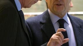 Le ministre français des Affaires étrangères, Alain Juppé, ici avec le député Axel Poniatowski, a déclaré mercredi considérer comme de la "manipulation" les promesses faites à la Russie par le président syrien, Bachar al Assad, accusé de massacres dans so