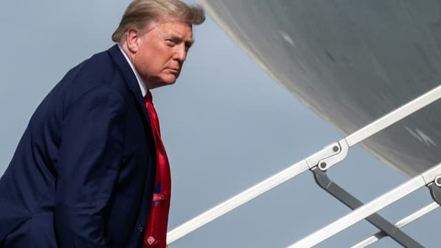 US President Donald Trump boards Air Force One on December 31, 2020 to leave his vacation in Florida early as he fumes against his election loss and as tensions rise with Iran