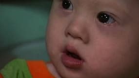 Gammy, l'enfant trisomique que le couple australien a abandonné à sa mère porteuse en Thaïlande. Le petit garçon est aujourd'hui âgé de 7 mois.