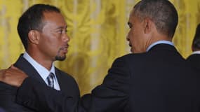 Le champion de golf Tiger Woods et Barack Obama, alors président des Etats-Unis en 2014 à la Maison Blanche.