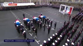 Les cercueils des quatre fonctionnaires de la préfecture de police de Paris sont portés dans la cour du bâtiment