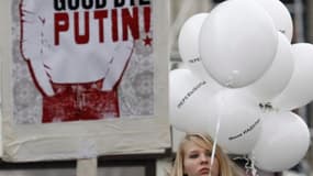 A Moscou, samedi, lors d'une manifestation qui a mobilisé des dizaines de milliers de Russes dénonçant le déroulement des élections législatives du 4 décembre. S'il espère que les fêtes de fin d'année briseront l'élan du mouvement de contestation en Russi