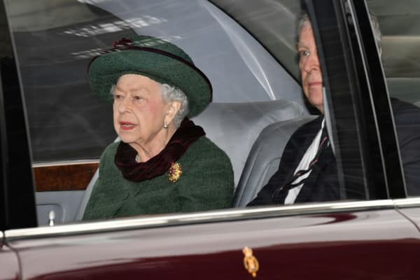 Queen Elizabeth II (l) and Prince Andrew arrive by car at a ceremony honoring Prince Philip, March 29, 2022 in Westminster Abbey, London