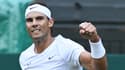 L'Espagnol Rafael Nadal célèbre sa victoire sur le Néerlandais Botic Van De Zandschulp lors de leur huitième de finale du simple messieurs à Wimbledon le 4 juillet 2022.
