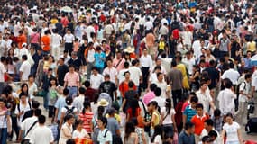 Des touristes chinois dans une gare de Pékin, en juillet 2007 (photo d'illustration).