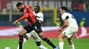 Randal Kolo Muani au duel avec Ruben Loftus-Cheek lors du match AC Milan-PSG (2-1), le 7 novembre 2023