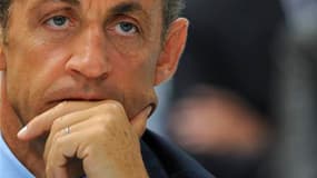 Selon le député UMP du Nord Christian Vanneste, Nicolas Sarkozy réfléchit à l'installation de jurés populaires auprès des magistrats professionnels des tribunaux correctionnels pour "rapprocher le peuple de la justice". /Photo prise le 3 septembre 2010/RE