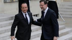François Hollande accueillant le président du gouvernement espagnol Mariano Rajoy à l'Elysée. La garantie des dépôts bancaires doit être un principe absolu dans la résolution des crises financières, ont déclaré le président français et son homologue espag