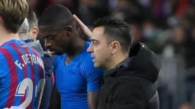 Xavi avec Ousmane Dembélé, à Barcelone le 4 décembre 2021