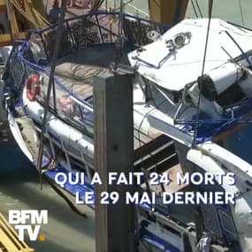 À l'aide d'une grue et de sangles, des sauveteurs ont repêché l'épave du bateau naufragé à Budapest