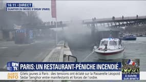 Des pompiers tentent d'éteindre un incendie sur une péniche, dans le quartier du musée d'Orsay à Paris