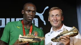 Usain Bolt en compagnie du président de l'époque, Jochen Zeist, en 2008.