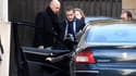 Nicolas Sarkozy entre dans sa voiture au matin du 15 février, la veille de sa convocation devant le juge pour l'affaire des comptes de campagne.
