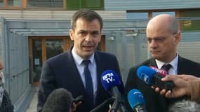 Olivier Véran et Jean-Michel Blanquer, devant l'éocle Louise Michel à Issy-les-Moulineaux, le 11 mars 2020.