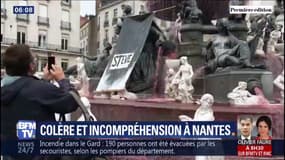 L'eau de la fontaine colorée en rouge, place Royale à Nantes, symbole de la mort de Steve Maia Caniço