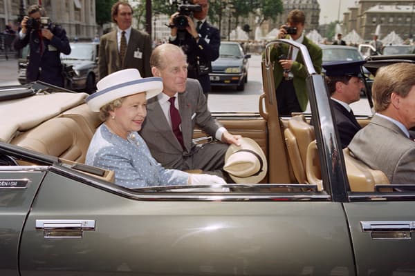 Queen Elizabeth II and her husband Duke of Edinburgh leave in a Citroen SM the City Hall in Paris on June 10, 1992 during a state visit in France.