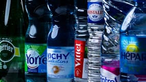 Des bouteilles d'eau minérale de marques appartenant au groupe Nestlé Waters, le 21 février 2024 à Paris