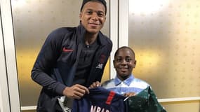 Kylian Mbappé (à gauche) avec Baba Jr
