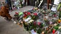 Des fleurs et des bougies devant le collège du Bois d'Aulne à Conflans-Sainte-Honorine