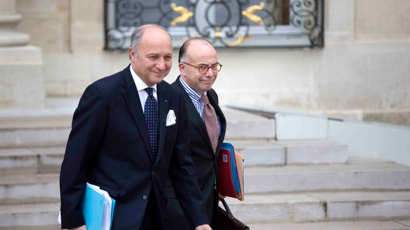 Laurent Fabius, ministre des Affaires étrangères, et Bernard Cazeneuve, ministre du Budget