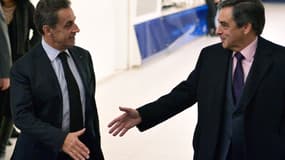 Nicolas Sarkozy et François Fillon au QG de l'UMP, rue de Vaugirard à Paris, le 2 décembre 2014.