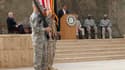 Au pupitre, le secrétaire américain à la Défense a prononcé jeudi le discours marquant officiellement le départ d'Irak des troupes américaines, près de neuf ans après leur intervention, en mars 2003, pour renverser Saddam Hussein. /Photo prise le 15 décem