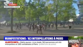 Marche pour le climat: des black blocs perturbent la fin de la manifestation sur les pelouses de Bercy